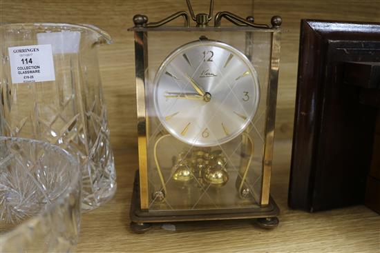A wall clock and a mantel clock